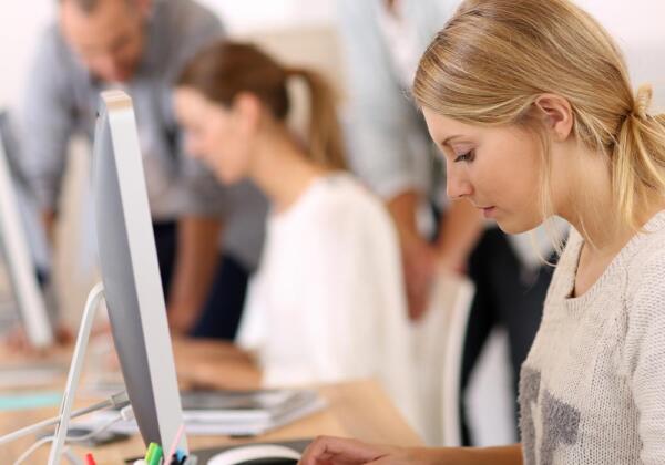 Woman working on computer in office
