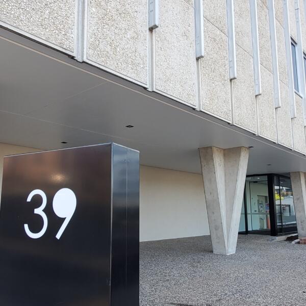 Image of 39 in front of Building.