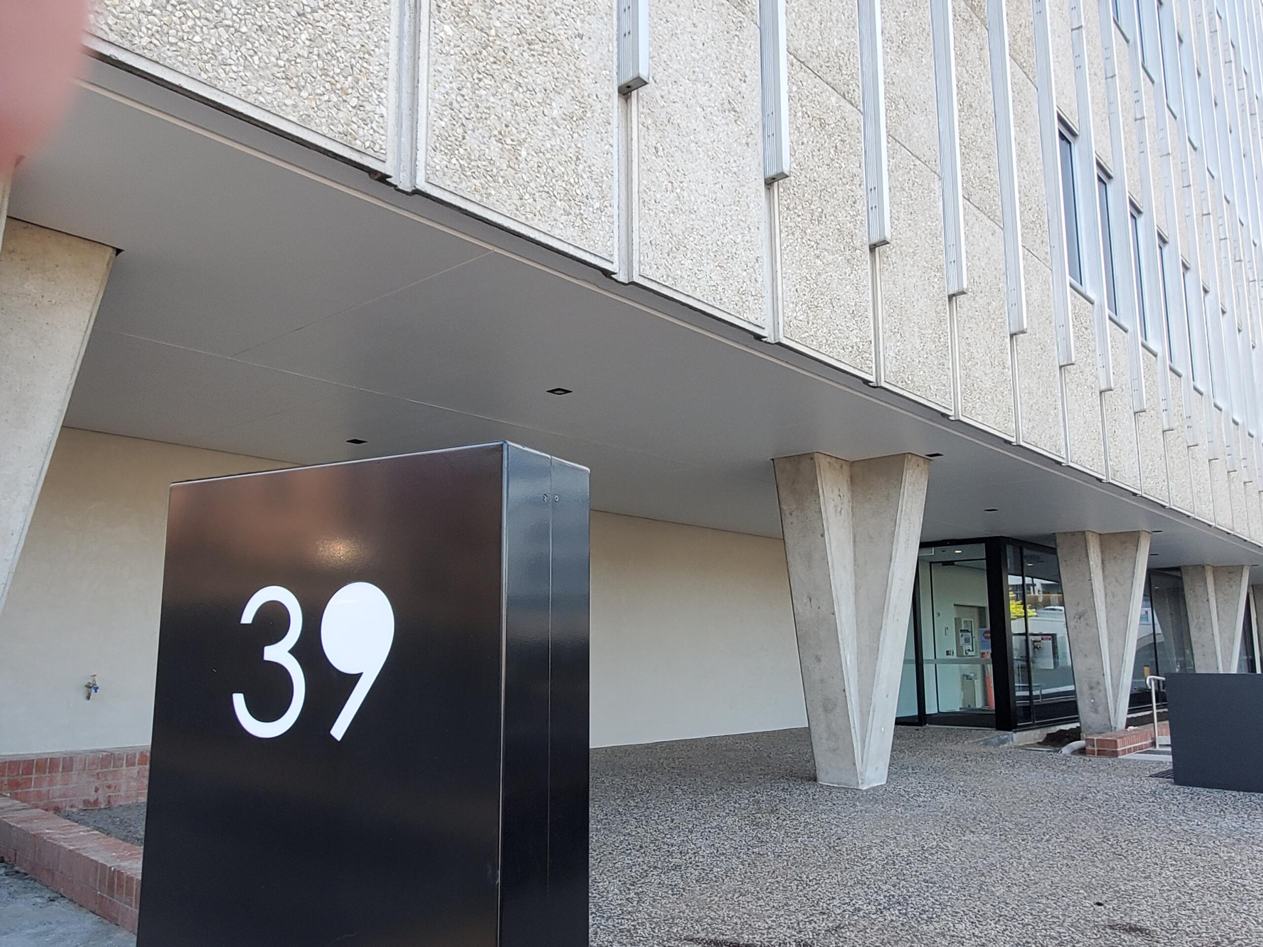 Image of 39 in front of Building.